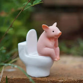 Cartoon pig desk ornament, pig sitting on the toilet, miniature pig figurine, creative toy, children's gift, desk decoration