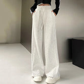 Women's basic elasticated track pants, available in white, grey, and black, with wide legs, straight leg, versatile fit, and high waist.