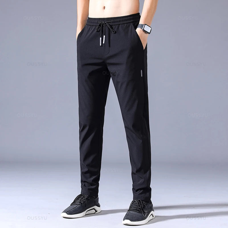 2025 Pantalon pour hommes printemps été nouveau mince vert couleur unie mode poche Applique pleine longueur Pantalon de travail décontracté Pantalon