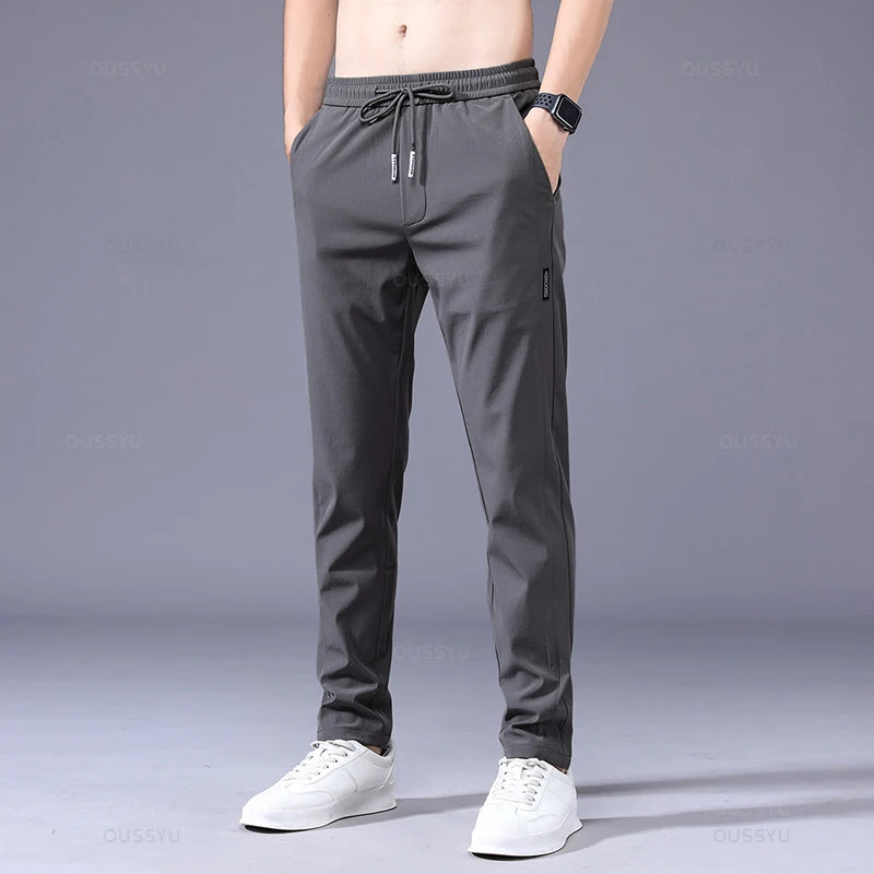 2025 Pantalon pour hommes printemps été nouveau mince vert couleur unie mode poche Applique pleine longueur Pantalon de travail décontracté Pantalon