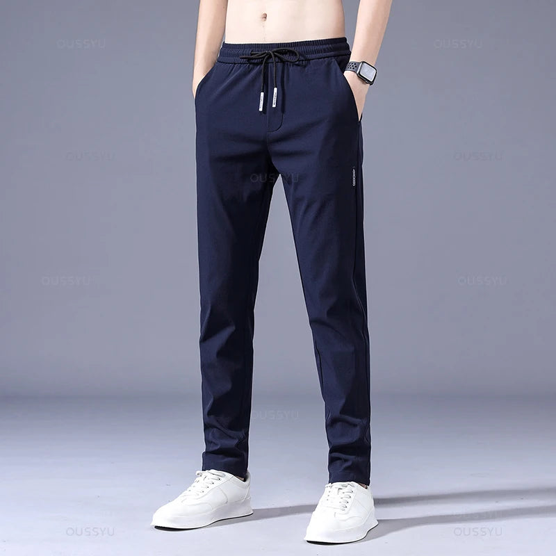 2025 Pantalon pour hommes printemps été nouveau mince vert couleur unie mode poche Applique pleine longueur Pantalon de travail décontracté Pantalon