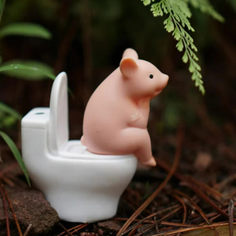 Cartoon pig desk ornament, pig sitting on the toilet, miniature pig figurine, creative toy, children's gift, desk decoration
