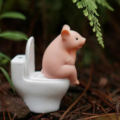 Cartoon pig desk ornament, pig sitting on the toilet, miniature pig figurine, creative toy, children's gift, desk decoration