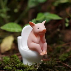 Cartoon pig desk ornament, pig sitting on the toilet, miniature pig figurine, creative toy, children's gift, desk decoration