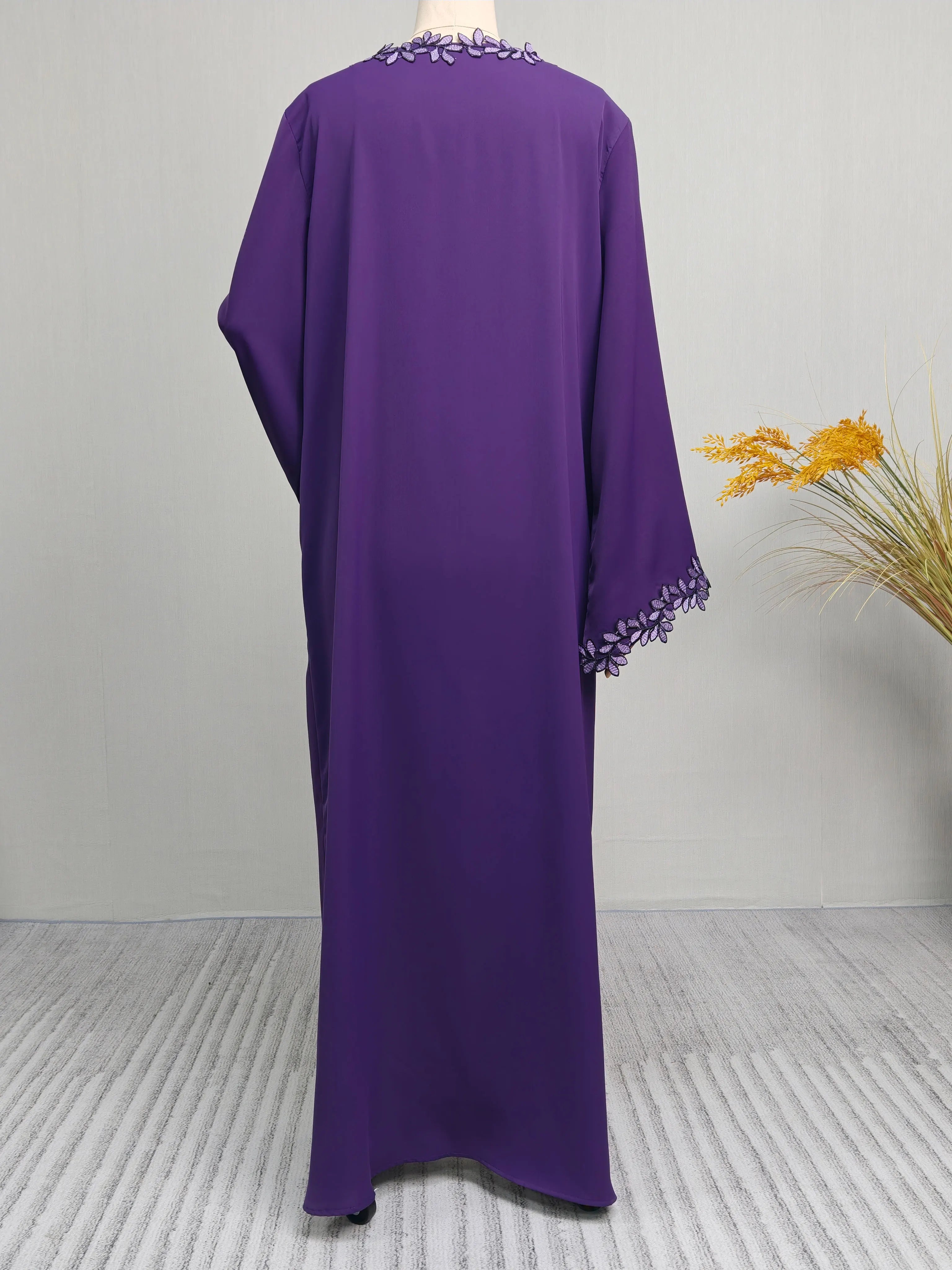 Elegant beige abaya from Dubai for Muslim women – Designed with a piece of multicolored embroidery in modest Islamic fashion