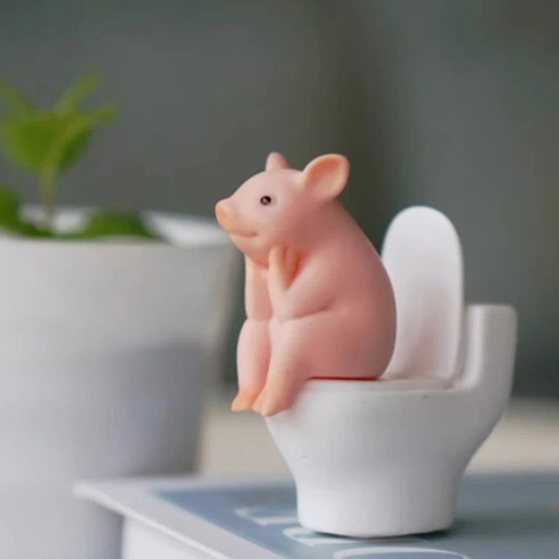 Cartoon pig desk ornament, pig sitting on the toilet, miniature pig figurine, creative toy, children's gift, desk decoration