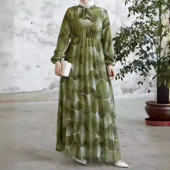 Abaya – a custom Muslim dress, leaf print, loose fit, long sleeves, suitable for Dubai parties, made of pleated chiffon.