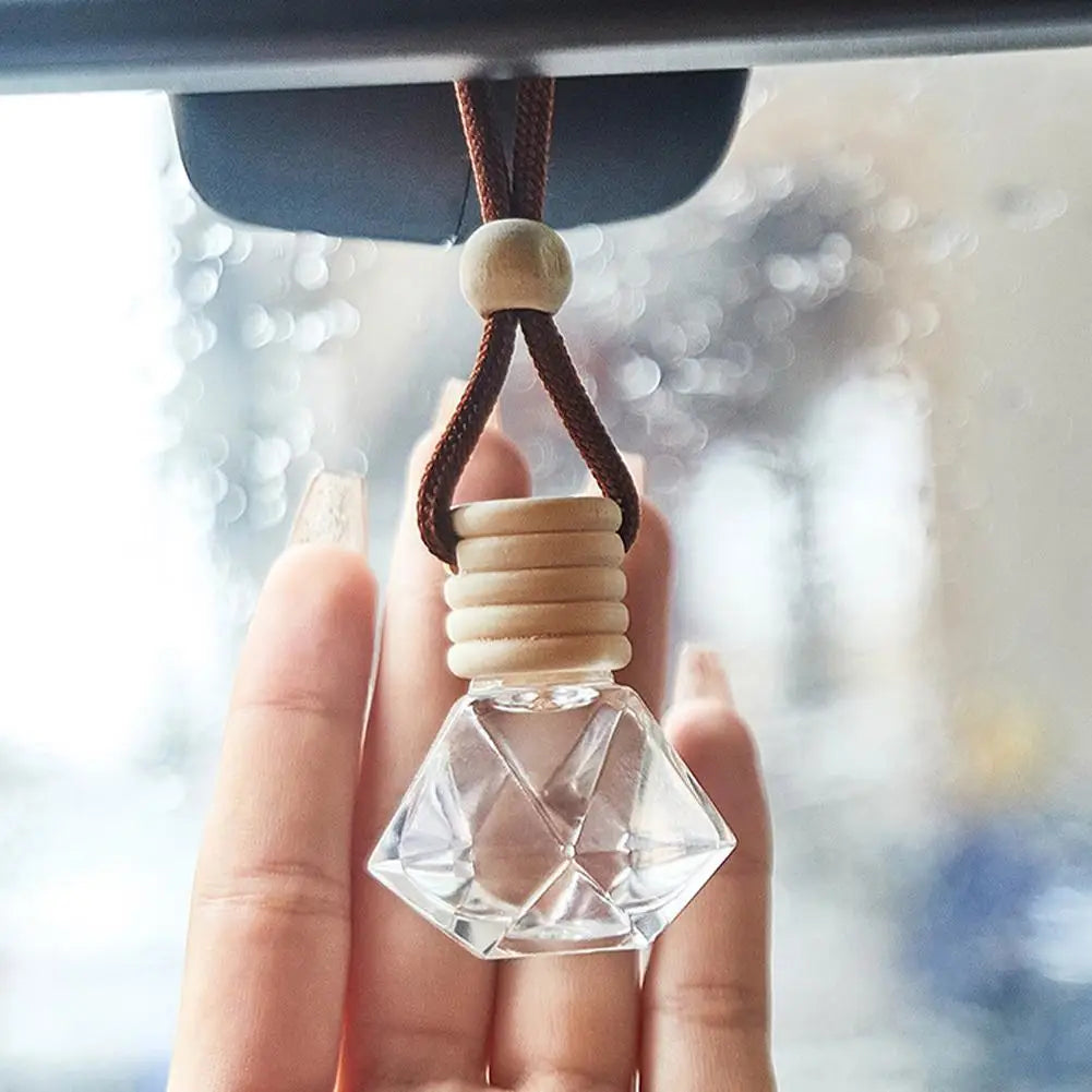 Diffuseur d'aromathérapie pour voiture, bouteille en verre suspendue, désodorisant automatique pour huiles essentielles, décor d'ornement de parfum de voiture naturel