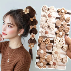 Set of 10 sporty hair accessories for girls with a floral design and a bow tie, in light beige color.