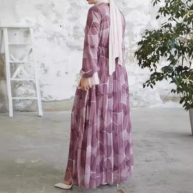 Abaya – a custom Muslim dress, leaf print, loose fit, long sleeves, suitable for Dubai parties, made of pleated chiffon.
