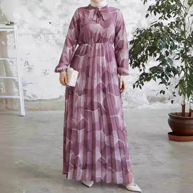Abaya – a custom Muslim dress, leaf print, loose fit, long sleeves, suitable for Dubai parties, made of pleated chiffon.