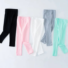 Girls' leggings for spring and summer, suitable for outdoor wear. They are slim-fitting, long pants for children.