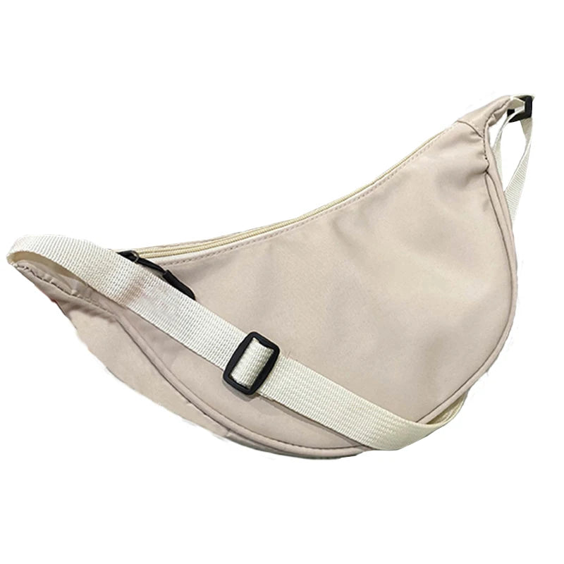 Sac pour femme – Un sac en nylon de forme ronde avec une bandoulière, adapté aux voyages, à l'école ou au shopping.