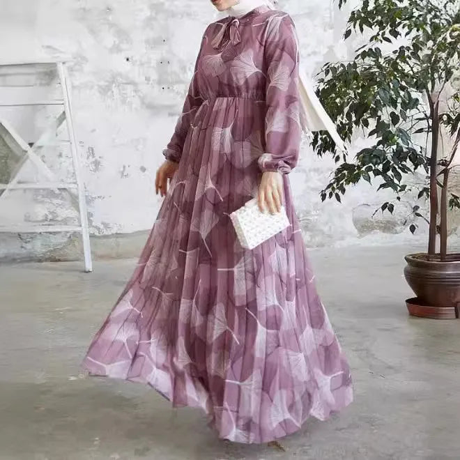 Abaya – a custom Muslim dress, leaf print, loose fit, long sleeves, suitable for Dubai parties, made of pleated chiffon.