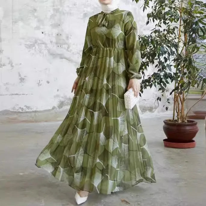Abaya – a custom Muslim dress, leaf print, loose fit, long sleeves, suitable for Dubai parties, made of pleated chiffon.