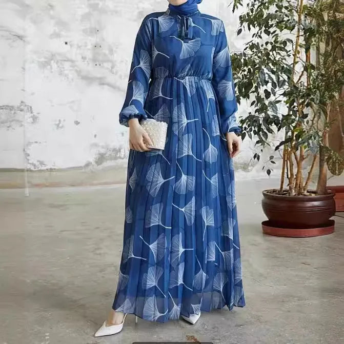 Abaya – a custom Muslim dress, leaf print, loose fit, long sleeves, suitable for Dubai parties, made of pleated chiffon.