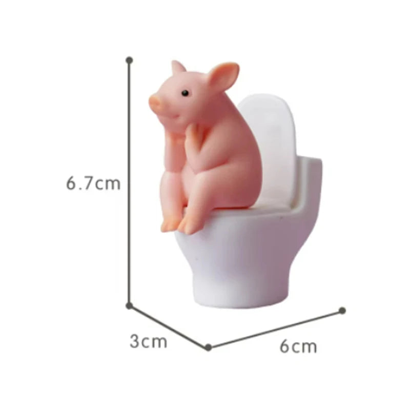 Cartoon pig desk ornament, pig sitting on the toilet, miniature pig figurine, creative toy, children's gift, desk decoration