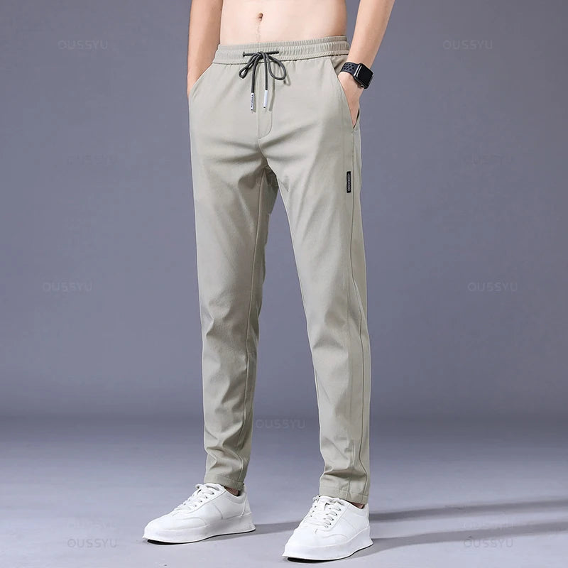 2025 Pantalon pour hommes printemps été nouveau mince vert couleur unie mode poche Applique pleine longueur Pantalon de travail décontracté Pantalon