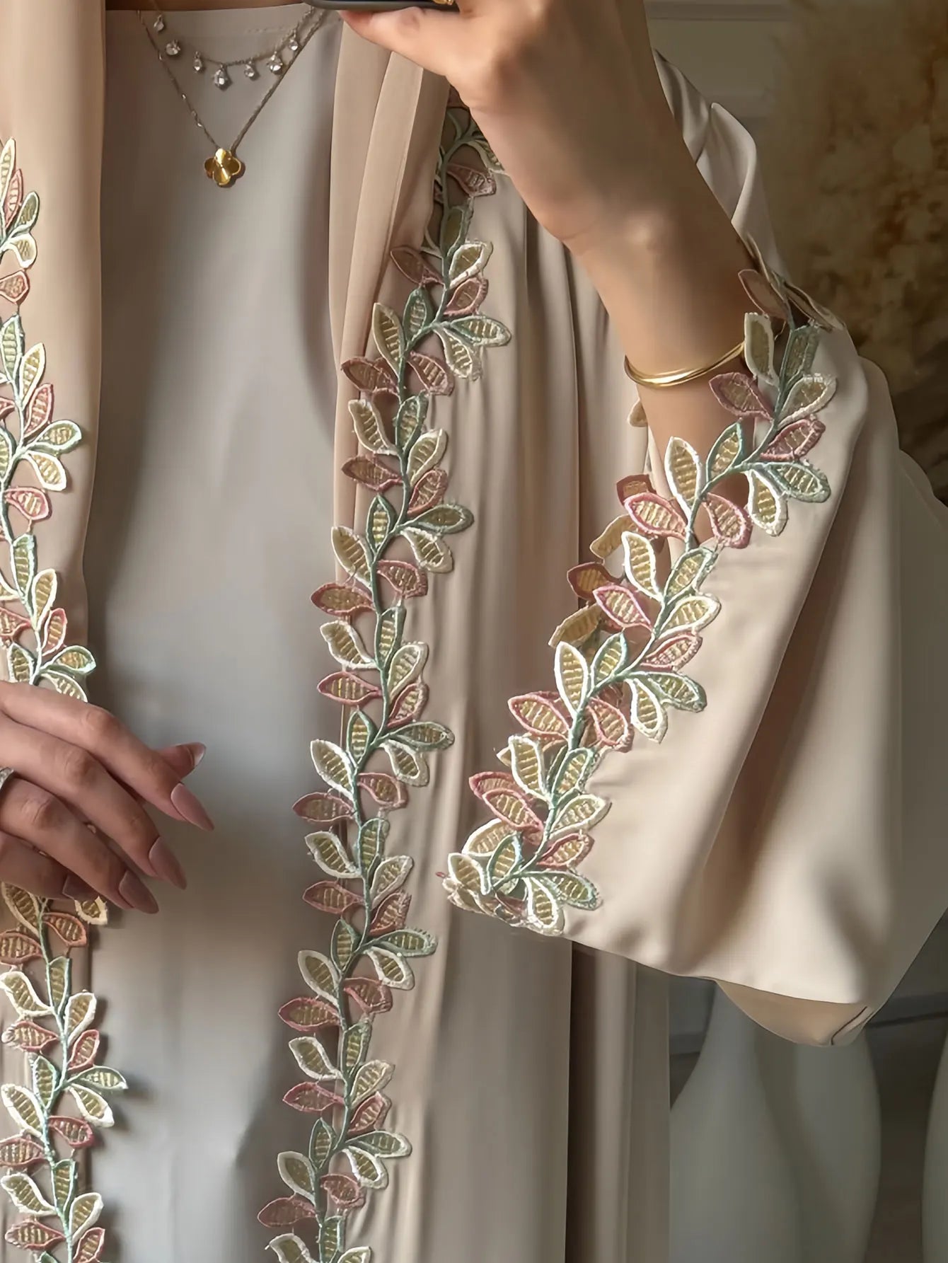 Elegant beige abaya from Dubai for Muslim women – Designed with a piece of multicolored embroidery in modest Islamic fashion