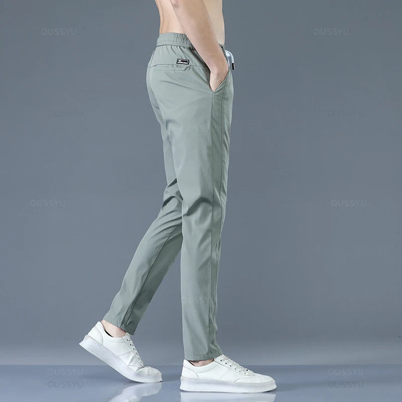 2025 Pantalon pour hommes printemps été nouveau mince vert couleur unie mode poche Applique pleine longueur Pantalon de travail décontracté Pantalon