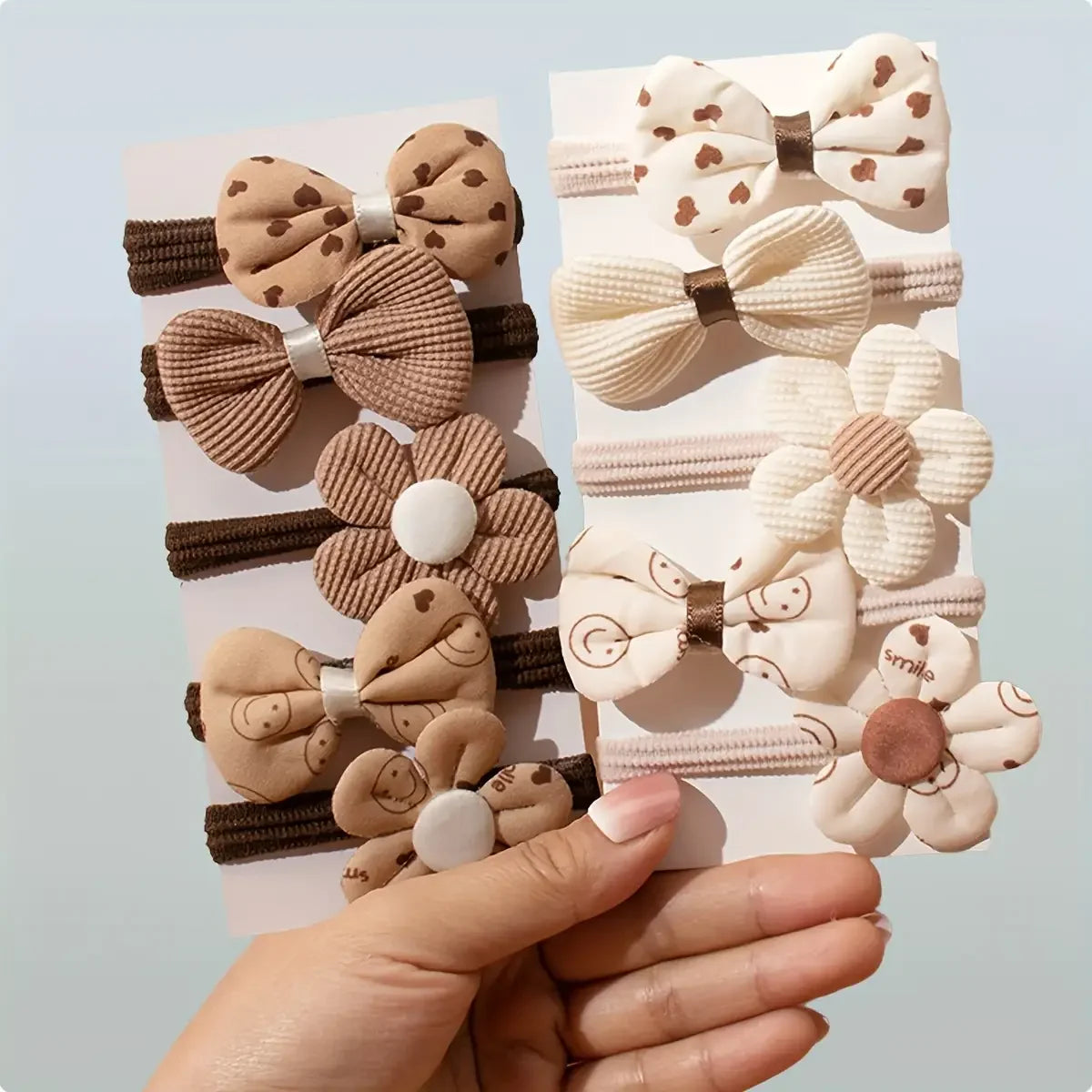 Set of 10 sporty hair accessories for girls with a floral design and a bow tie, in light beige color.