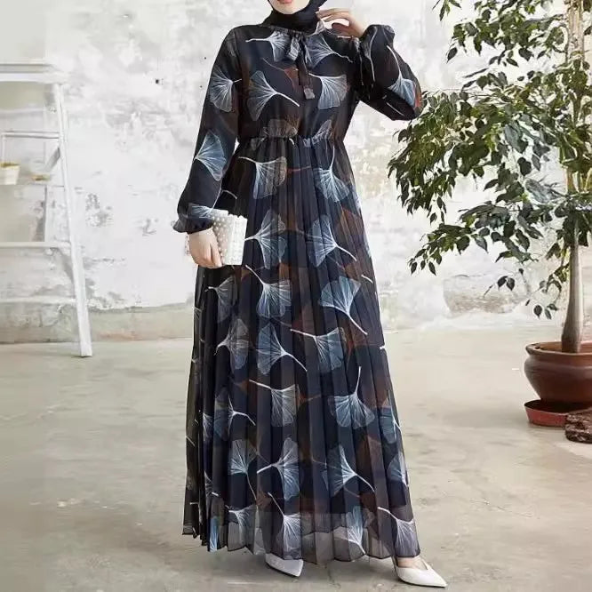 Abaya – a custom Muslim dress, leaf print, loose fit, long sleeves, suitable for Dubai parties, made of pleated chiffon.