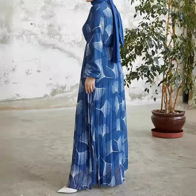 Abaya – a custom Muslim dress, leaf print, loose fit, long sleeves, suitable for Dubai parties, made of pleated chiffon.