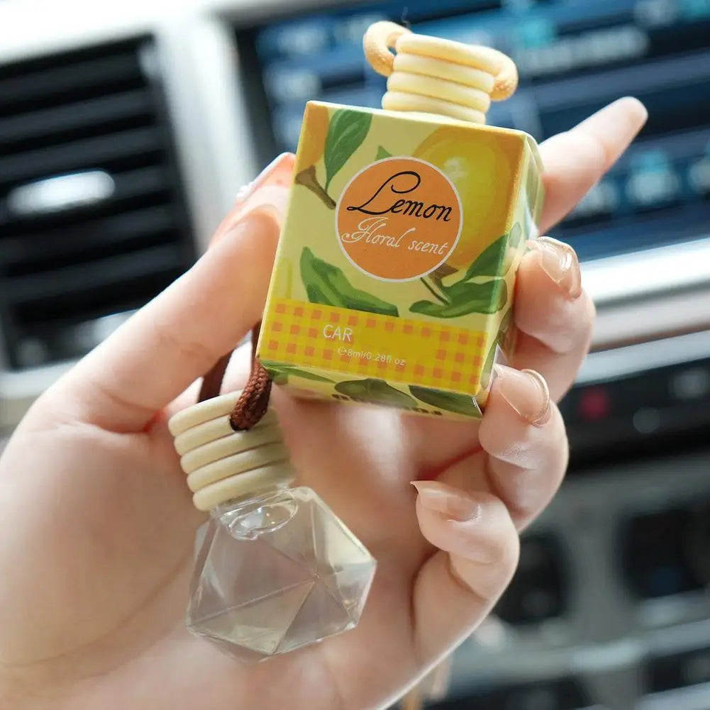 Diffuseur d'aromathérapie pour voiture, bouteille en verre suspendue, désodorisant automatique pour huiles essentielles, décor d'ornement de parfum de voiture naturel
