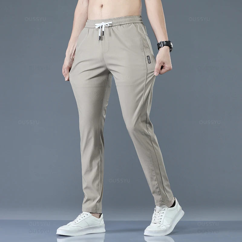 2025 Pantalon pour hommes printemps été nouveau mince vert couleur unie mode poche Applique pleine longueur Pantalon de travail décontracté Pantalon