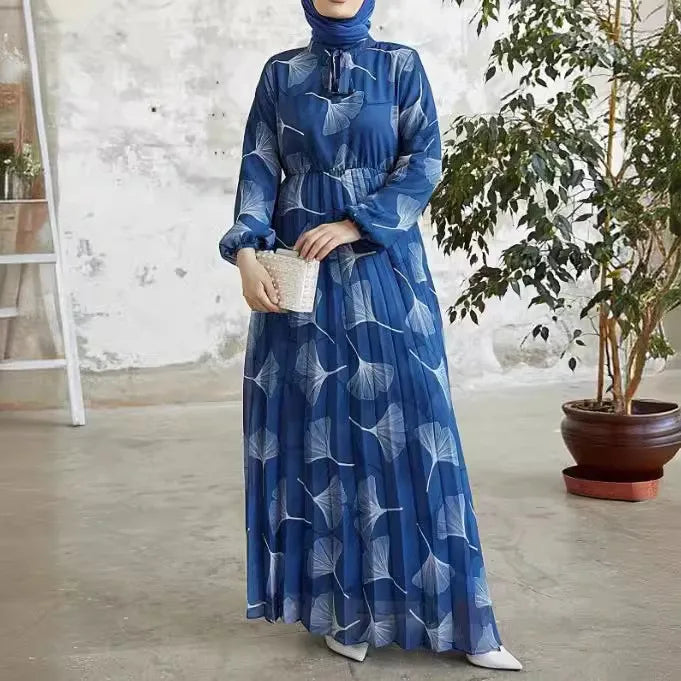 Abaya – a custom Muslim dress, leaf print, loose fit, long sleeves, suitable for Dubai parties, made of pleated chiffon.