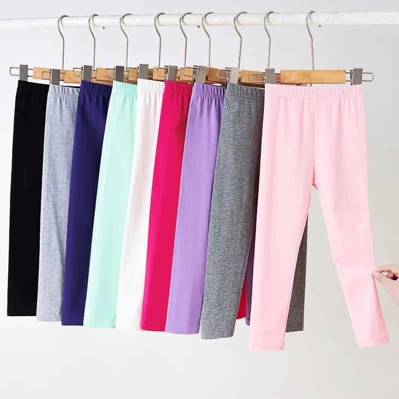 Girls' leggings for spring and summer, suitable for outdoor wear. They are slim-fitting, long pants for children.