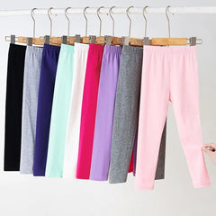 Girls' leggings for spring and summer, suitable for outdoor wear. They are slim-fitting, long pants for children.