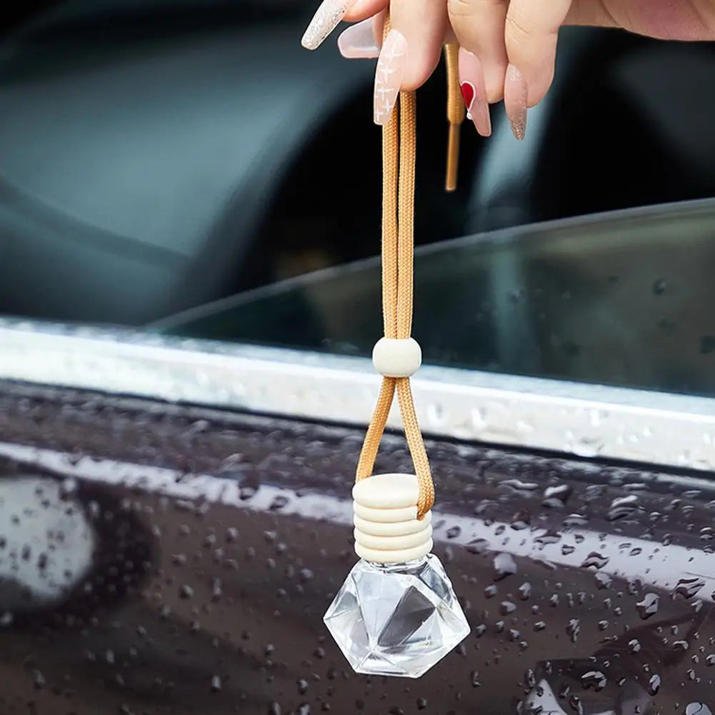 Diffuseur d'aromathérapie pour voiture, bouteille en verre suspendue, désodorisant automatique pour huiles essentielles, décor d'ornement de parfum de voiture naturel