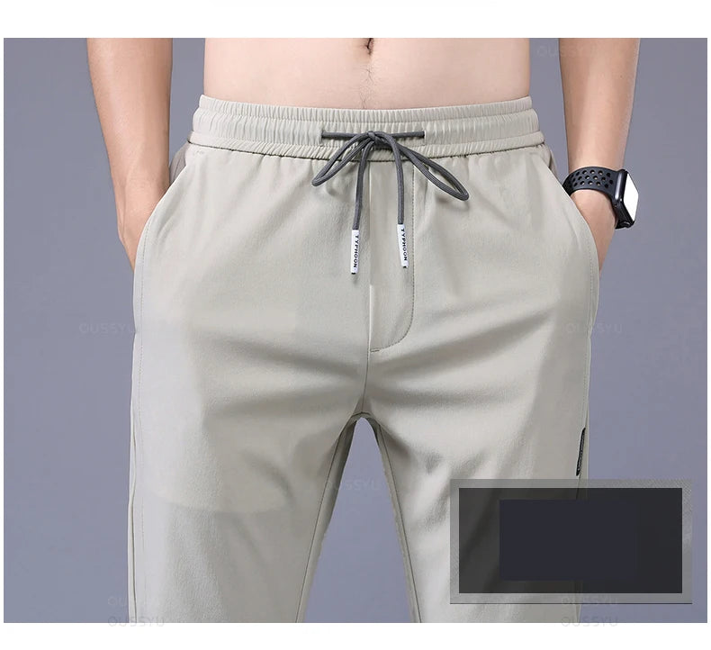 2025 Pantalon pour hommes printemps été nouveau mince vert couleur unie mode poche Applique pleine longueur Pantalon de travail décontracté Pantalon