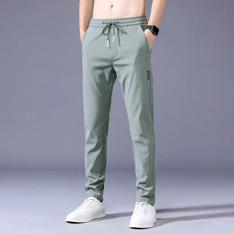 2025 Pantalon pour hommes printemps été nouveau mince vert couleur unie mode poche Applique pleine longueur Pantalon de travail décontracté Pantalon