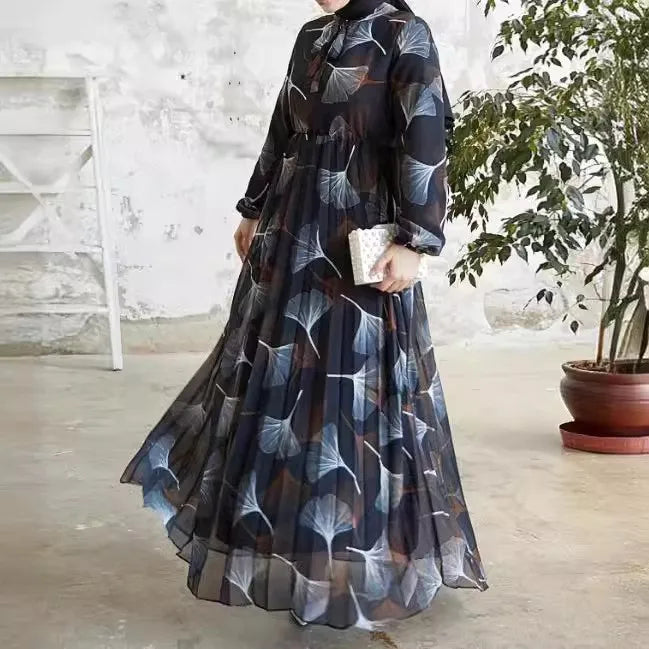 Abaya – a custom Muslim dress, leaf print, loose fit, long sleeves, suitable for Dubai parties, made of pleated chiffon.