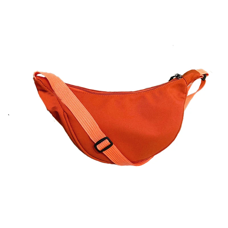 Sac pour femme – Un sac en nylon de forme ronde avec une bandoulière, adapté aux voyages, à l'école ou au shopping.