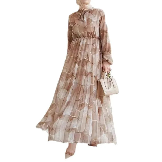 Abaya – a custom Muslim dress, leaf print, loose fit, long sleeves, suitable for Dubai parties, made of pleated chiffon.